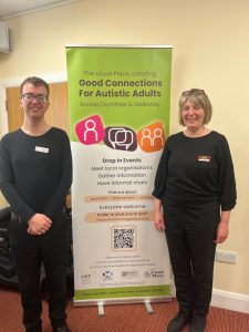 Man and woman standing with Good Connections for Autistic Adults Promotional Banner